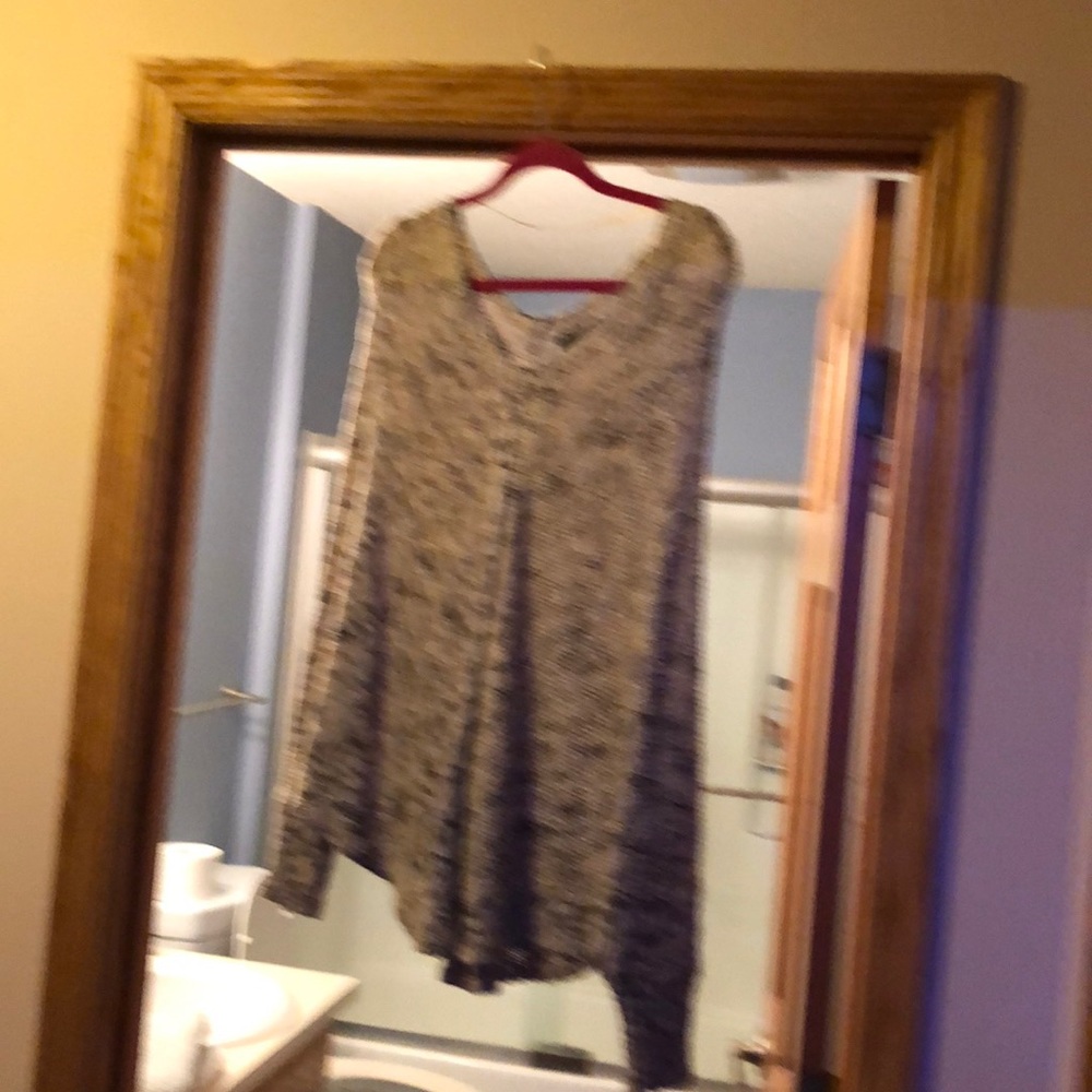 Cute poncho with arm sleeves.